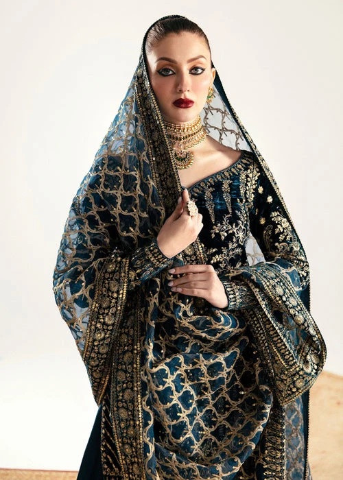 Kanwal Malik Nazmi valvet Pakistani fashion outfit in teal tones.